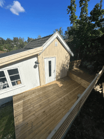 Half-cleaned concrete roof with moss removed from one side